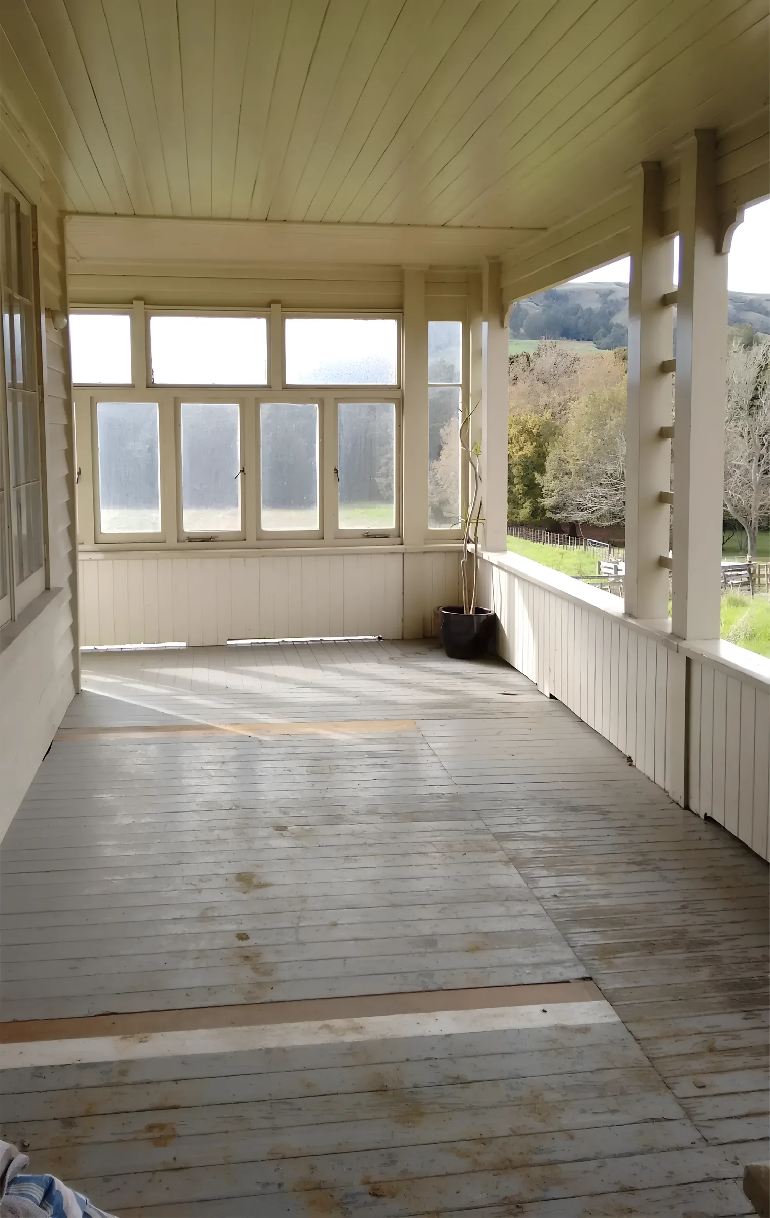 Before: the original weathered villa verandah